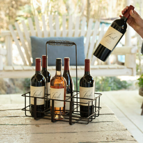 Josh bottles in wine carrying basket