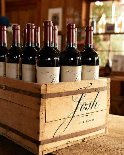 Josh cellars wine bottles in a wooden crate